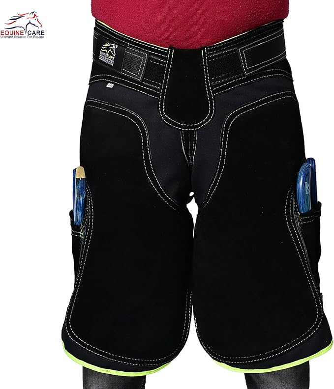Equine Care Women’s Farrier Apron Chaps 23″ – Leather & Canvas, Adjustable 28–52″ Waist, EVA Padded Knees, Lumbar Support, 4 Knife Pockets & Nail Magnets for Hoof Trimming (Black with Green Piping)